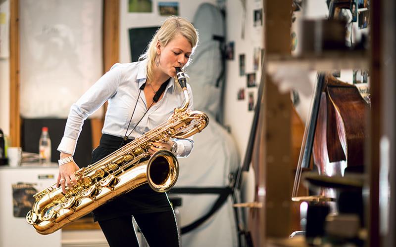 a woman with a saxophone