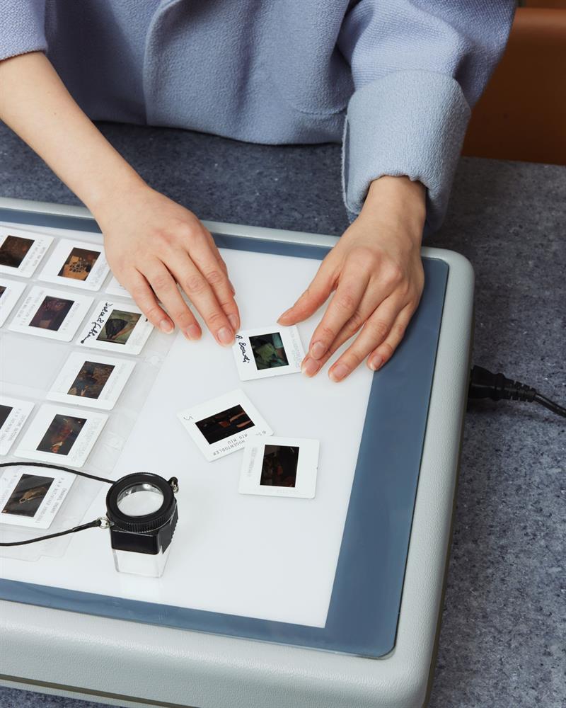 Detail of hands holding a photography