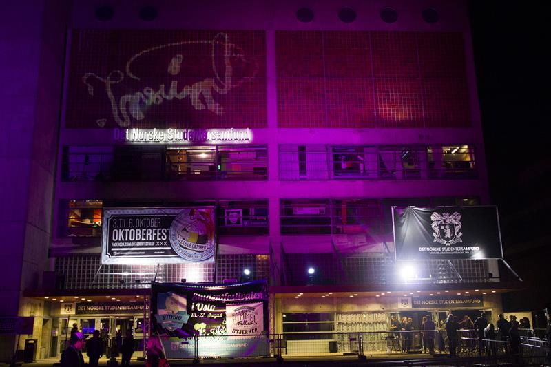 The building covered in neon lights.