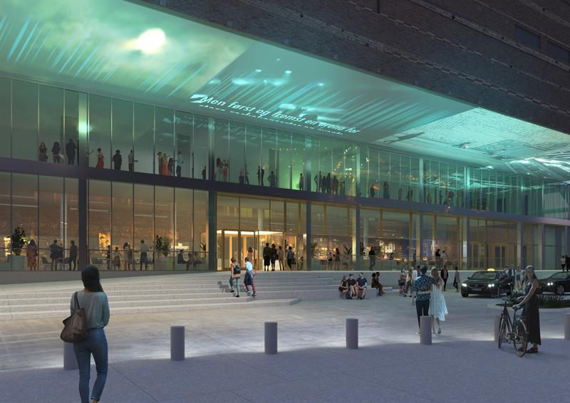 Kveldsbilde av en moderne bygning med en opplyst glassfasade og mennesker som samles utenfor.